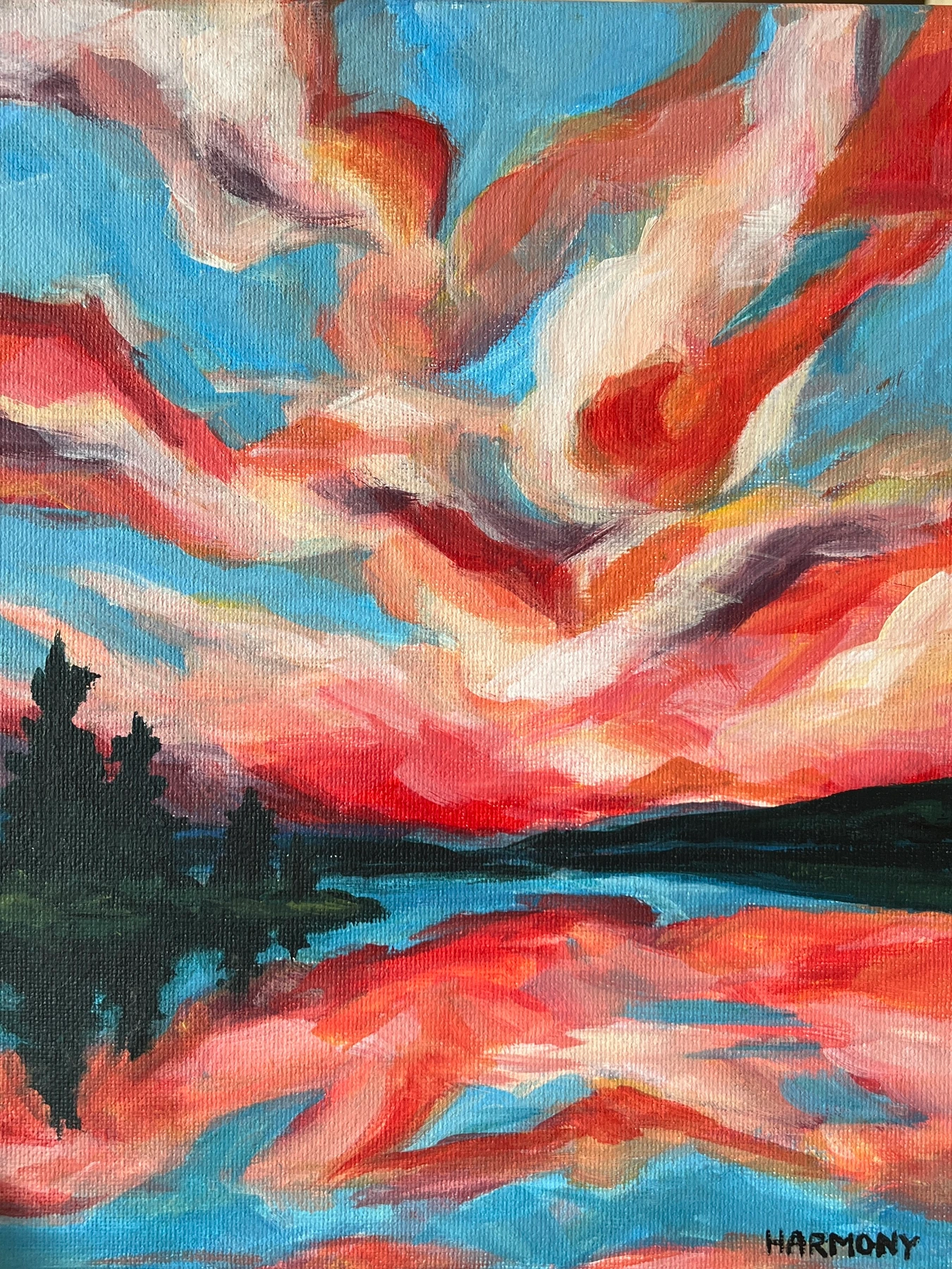 Vibrant red and blue sunset over water